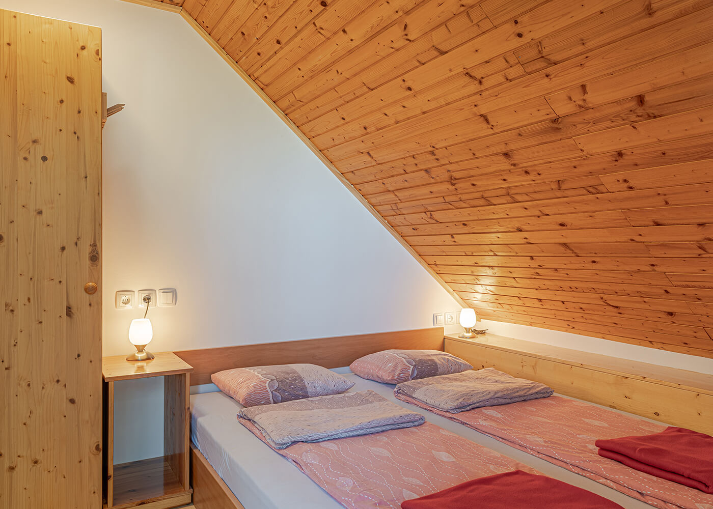 Double bed in bedroom number one for two persons with a balcony