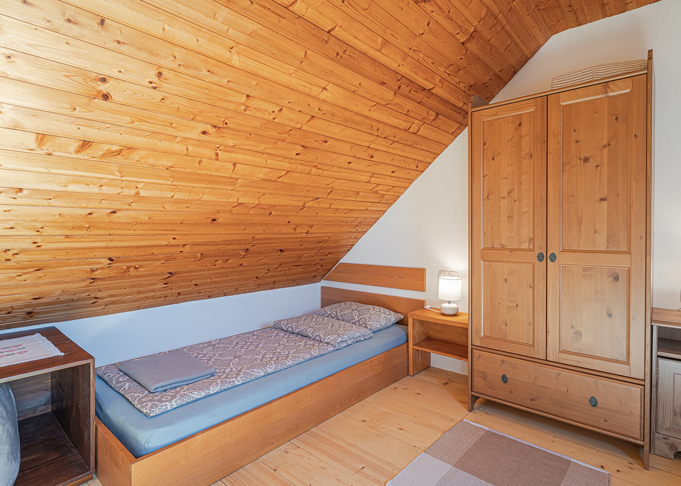 Bed in bedroom number two of Marijan house with decorations